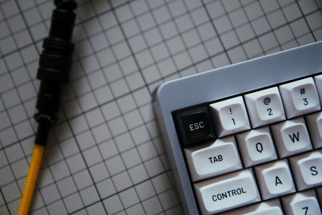 Padlock icon over a computer keyboard representing cybersecurity
