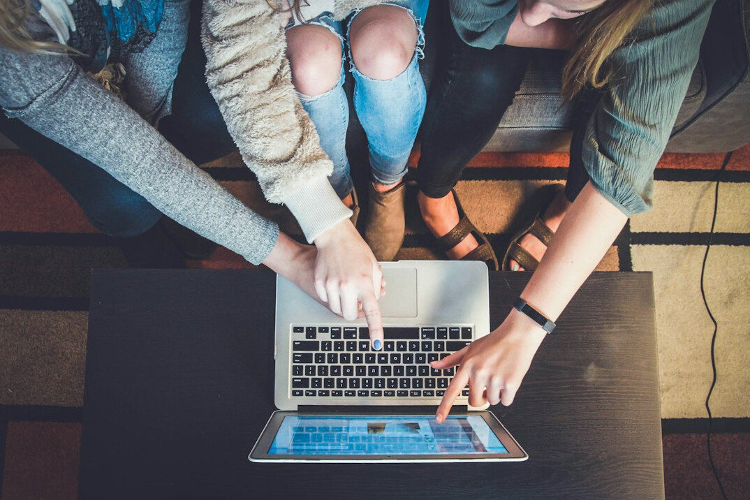 group of friends learning code